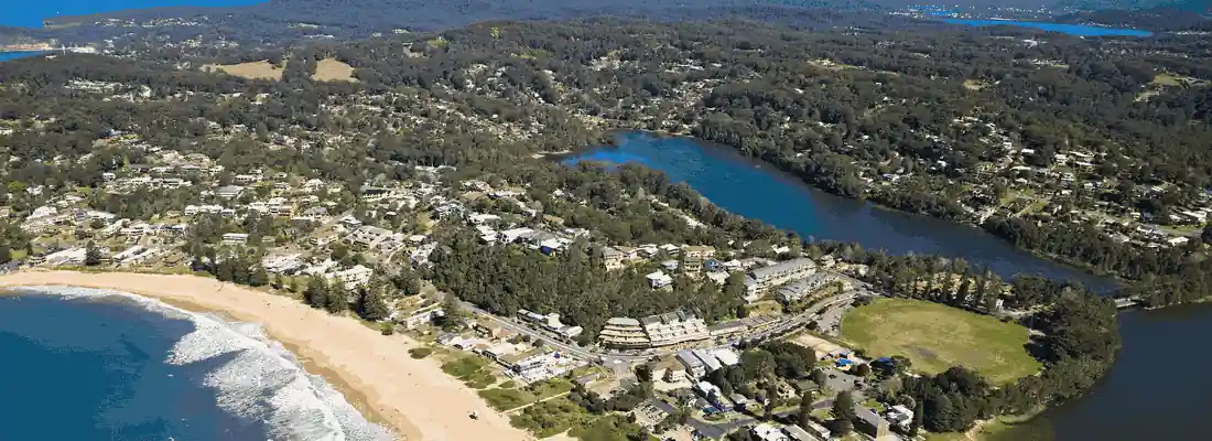 Suburb-on-The-Central-Coast-Showing-Beach-and-Houses-Aerial-View-CityCoast-Removals